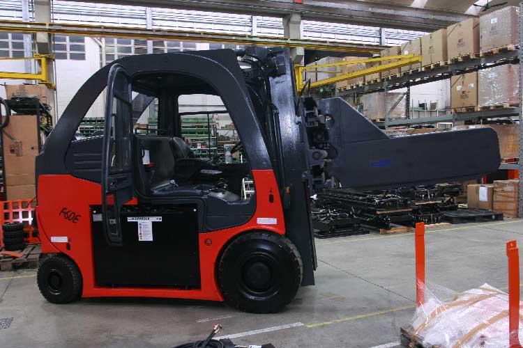 Heavy Duty compact F series forklift shown with large bale clamp