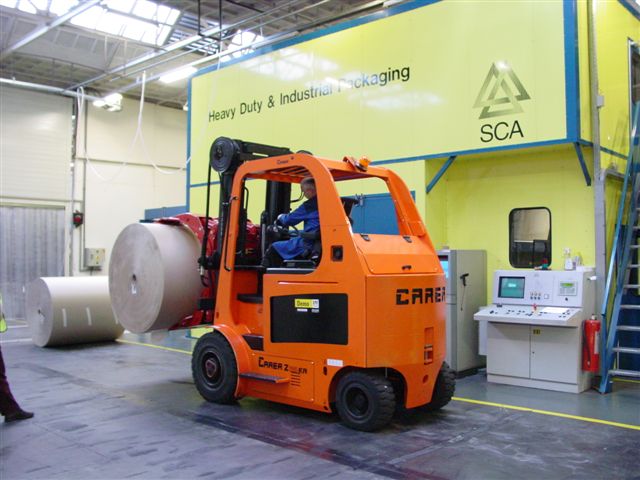 Heavy Duty compact Z series forklift shown with large paper roll clamp