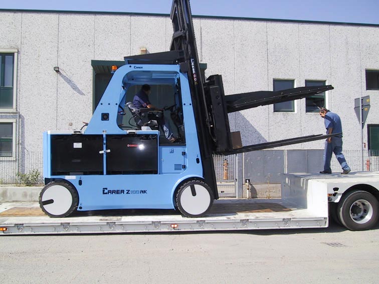 Heavy Duty 22,000 lbs specialty lift loaded on low boy trailer