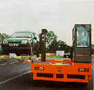 sideloading forklift in action stacking cars