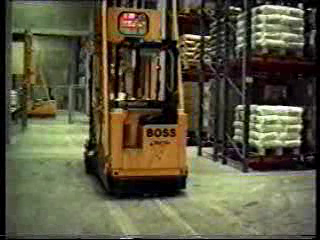 Free roaming driverless turret forklift services warehouse